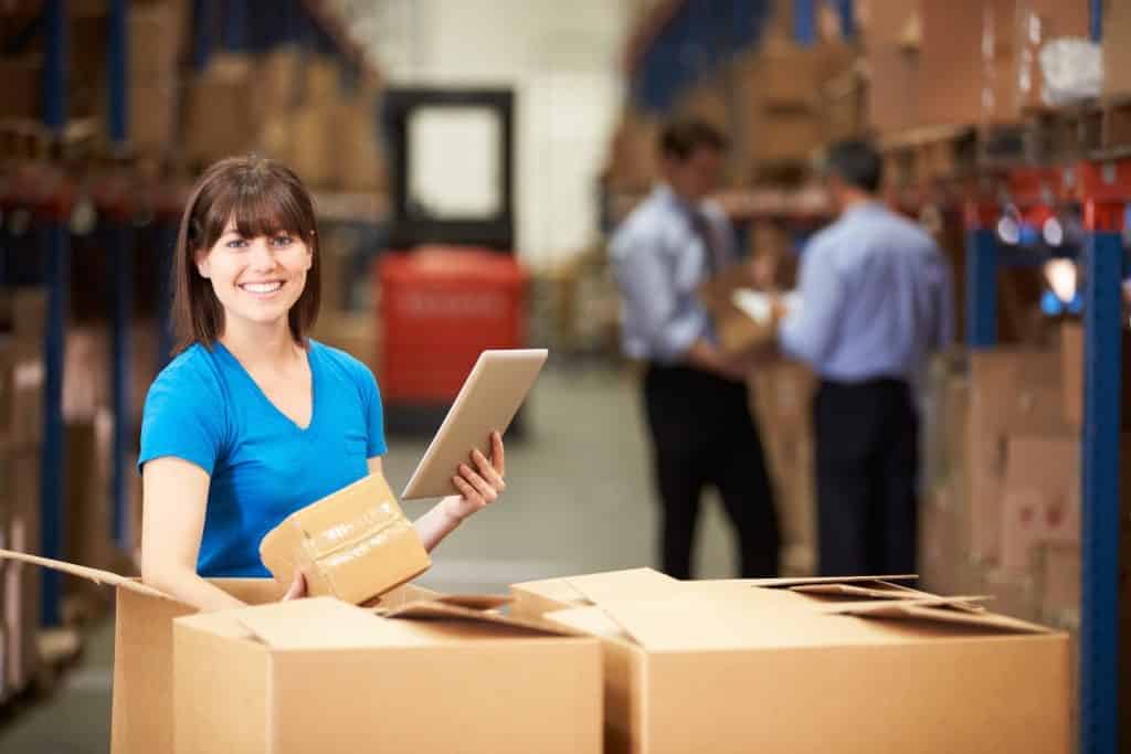 Woman Smiling While Checking Package Content