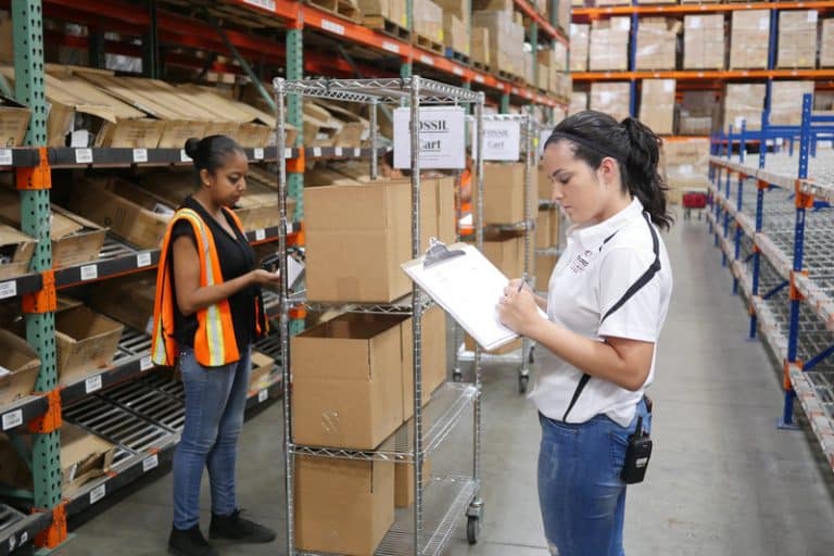 Women Double Checking the Products at the Taylored Services Warehouse
