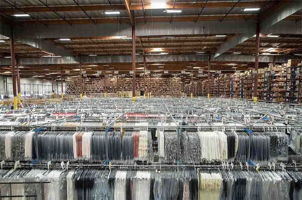 Warehouse With Garments On Hanger