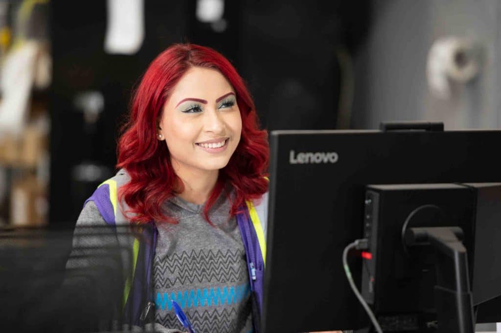 Red Haired Woman Working Happily