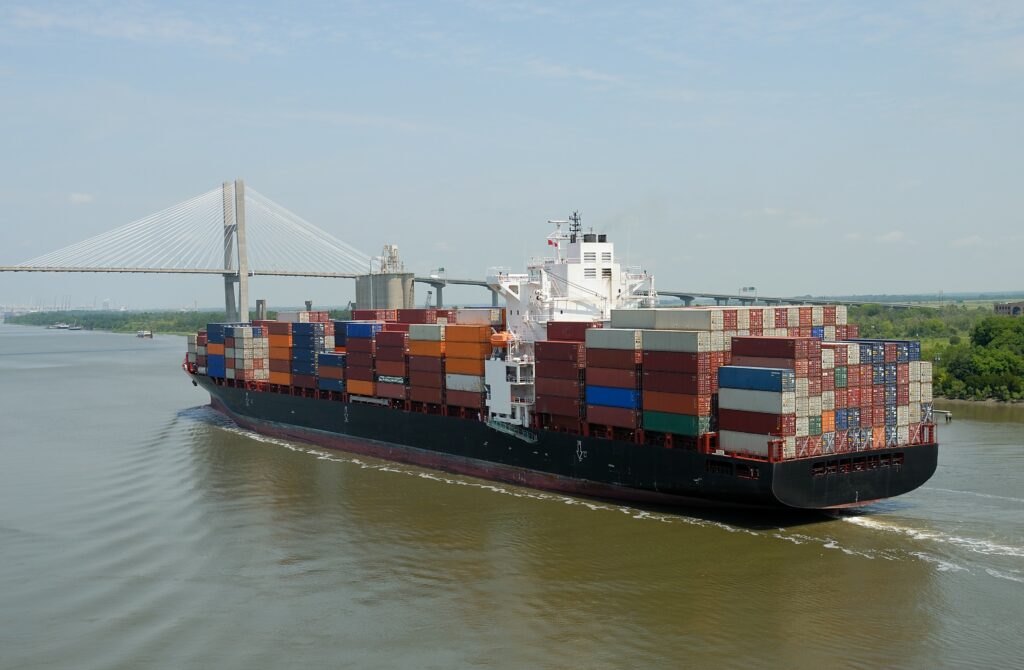 Cargo Container Ship Passing Through a Bridge