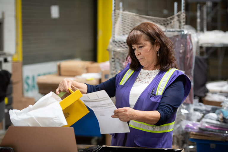 Woman Employee Checking Item Details
