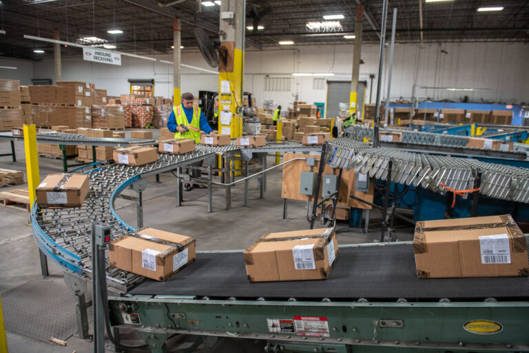 Boxes Carried By A Conveyor Belt
